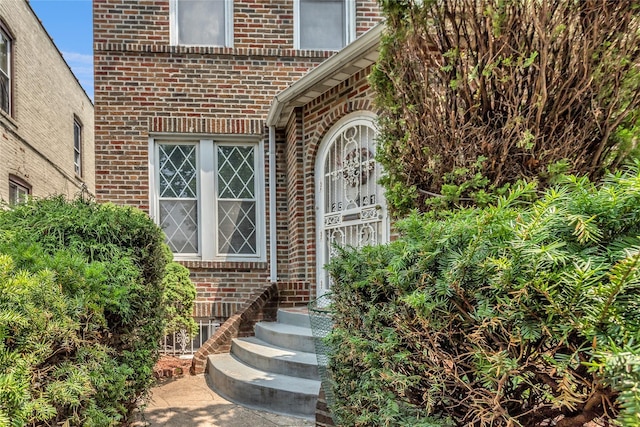 2541 83rd St, East Elmhurst, NY 11370 - doorway to property featuring brick siding
