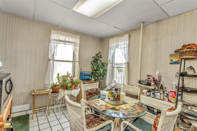 2541 83rd St, East Elmhurst, NY 11370 - tiled dining space featuring a paneled ceiling