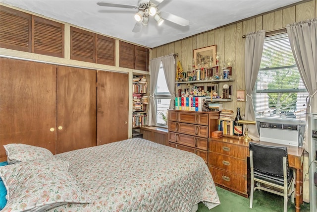 2541 83rd St, East Elmhurst, NY 11370 - bedroom with an office area, multiple windows, a closet, cooling unit, and wood walls