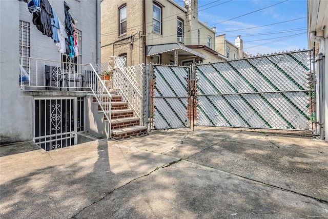 2541 83rd St, East Elmhurst, NY 11370 - view of home's exterior featuring a gate