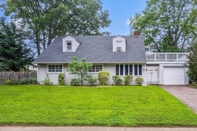 49 Radcliff Ave, Port Washington, NY 11050 - new england style home with decorative driveway, a chimney, roof with shingles, and an attached garage