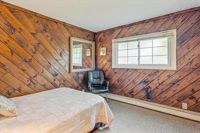 49 Radcliff Ave, Port Washington, NY 11050 - bedroom featuring multiple windows, baseboard heating, carpet floors, and wooden walls