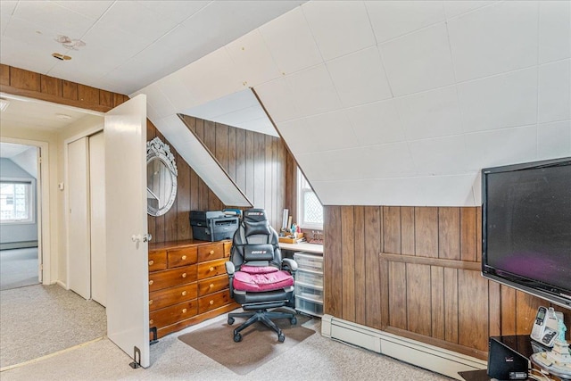 49 Radcliff Ave, Port Washington, NY 11050 - home office with a baseboard radiator, wood walls, carpet flooring, and vaulted ceiling
