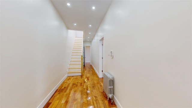 442 Newport St, Brooklyn, NY 11207 - corridor with radiator, recessed lighting, light wood-type flooring, and stairs