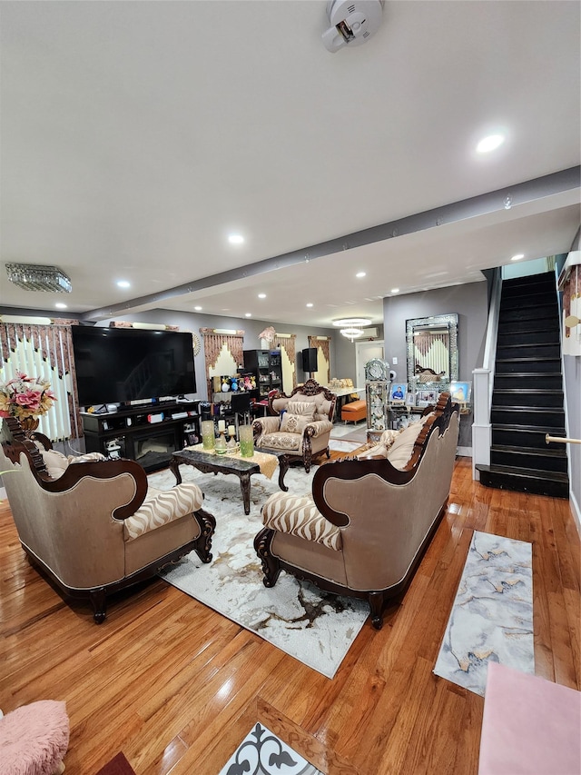 18701 Keeseville Ave, Saint Albans, NY 11412 - living room featuring stairs, recessed lighting, and hardwood / wood-style floors