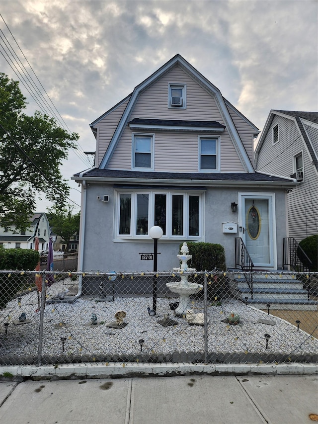 18701 Keeseville Ave, Saint Albans, NY 11412 - colonial inspired home with stucco siding, entry steps, and a gambrel roof