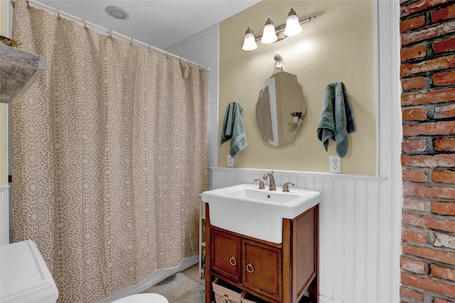 603 High St, Port Jefferson, NY 11777 - full bath with wainscoting, vanity, and a shower with curtain