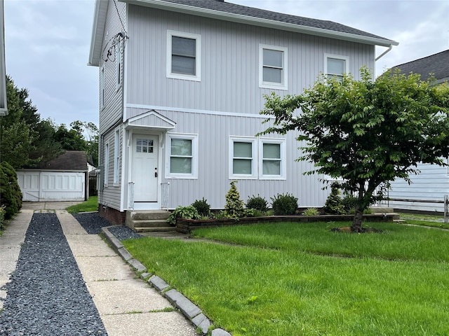 18 Carman St, Patchogue, NY 11772 - view of front of home featuring a front yard and entry steps
