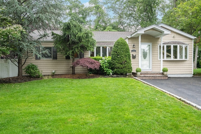 1241 Lednam Ct, Merrick, NY 11566 - view of front of property featuring roof with shingles and a front lawn