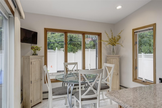 1241 Lednam Ct, Merrick, NY 11566 - dining room with healthy amount of natural light, recessed lighting, and a baseboard heating unit