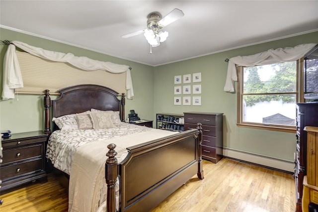 1241 Lednam Ct, Merrick, NY 11566 - bedroom with baseboard heating, light wood-style flooring, crown molding, and a ceiling fan