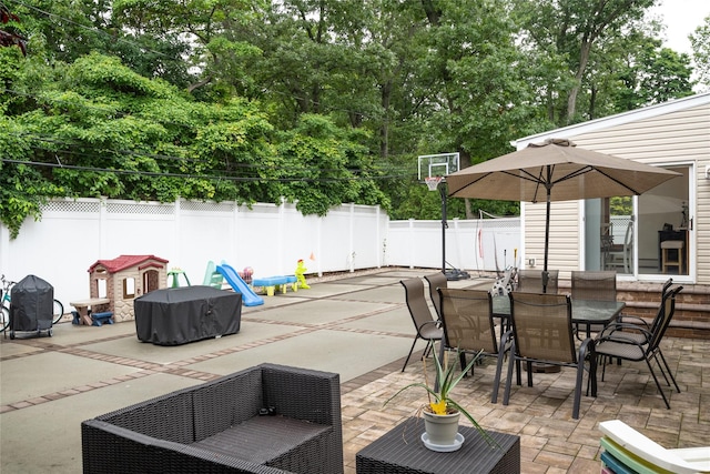 1241 Lednam Ct, Merrick, NY 11566 - fenced backyard with a patio area, outdoor dining space, and an outdoor hangout area