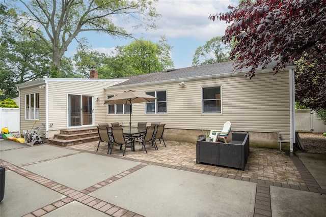 1241 Lednam Ct, Merrick, NY 11566 - back of house with a patio area, a chimney, and entry steps