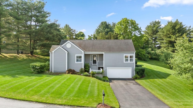 29 Underhill Rd N, Poughquag, NY 12570 - view of front of home with a garage, asphalt driveway, a front lawn, and view of scattered trees