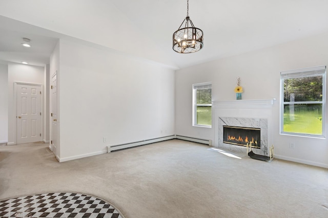 29 Underhill Rd N, Poughquag, NY 12570 - unfurnished living room with carpet floors, baseboard heating, a chandelier, and plenty of natural light