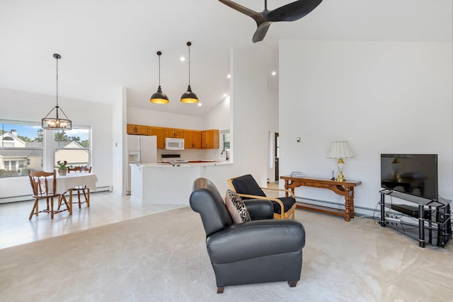 29 Underhill Rd N, Poughquag, NY 12570 - living area featuring light carpet, high vaulted ceiling, a ceiling fan, a chandelier, and baseboard heating