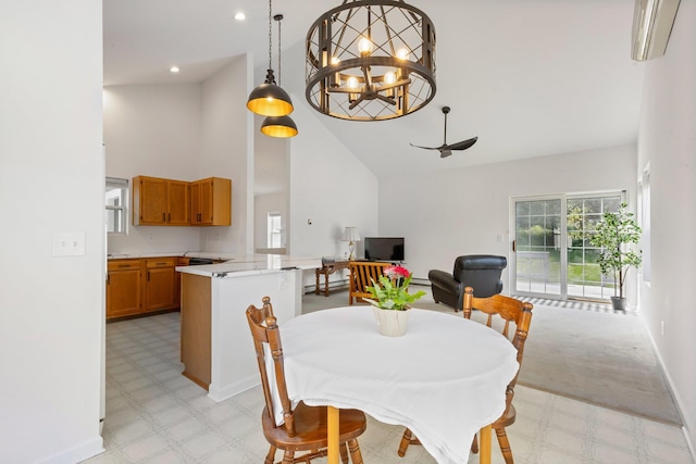 29 Underhill Rd N, Poughquag, NY 12570 - dining room with high vaulted ceiling, light flooring, a chandelier, and ceiling fan