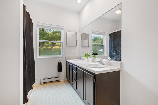 29 Underhill Rd N, Poughquag, NY 12570 - full bath featuring a baseboard heating unit, double vanity, and tile patterned floors