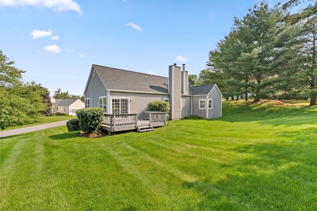 29 Underhill Rd N, Poughquag, NY 12570 - rear view of house with a chimney, a lawn, a wooden deck, and a shingled roof