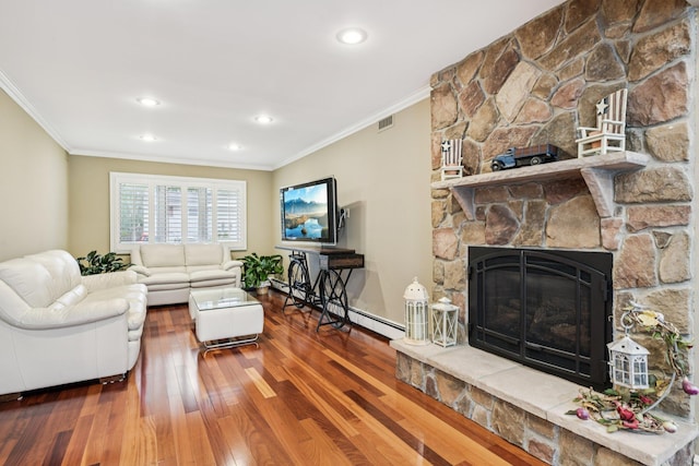 57 Sarah Dr, Lake Grove, NY 11755 - living area featuring crown molding, baseboard heating, a fireplace, wood finished floors, and recessed lighting