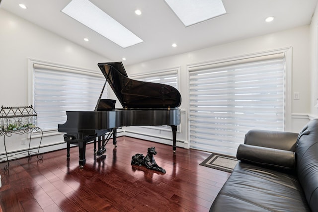 57 Sarah Dr, Lake Grove, NY 11755 - living area featuring lofted ceiling, a baseboard radiator, a skylight, wood finished floors, and recessed lighting