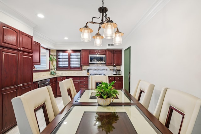 57 Sarah Dr, Lake Grove, NY 11755 - dining room with crown molding, a chandelier, and recessed lighting