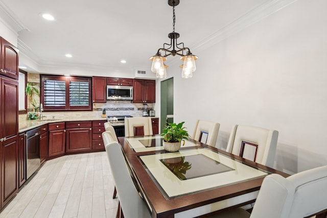 57 Sarah Dr, Lake Grove, NY 11755 - dining area with ornamental molding, a chandelier, recessed lighting, and light wood-style floors
