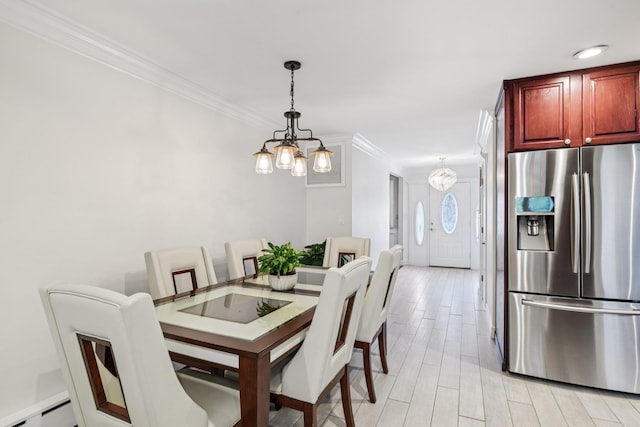 57 Sarah Dr, Lake Grove, NY 11755 - dining area with a chandelier, crown molding, a baseboard radiator, and light wood-type flooring