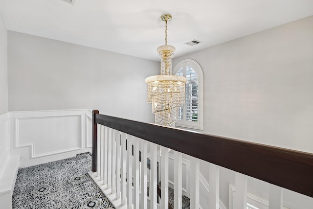 57 Sarah Dr, Lake Grove, NY 11755 - corridor featuring a chandelier and an upstairs landing