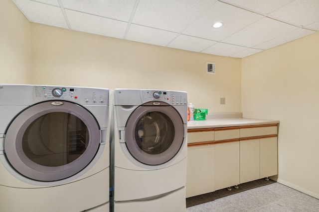57 Sarah Dr, Lake Grove, NY 11755 - laundry room with washer and clothes dryer and cabinet space