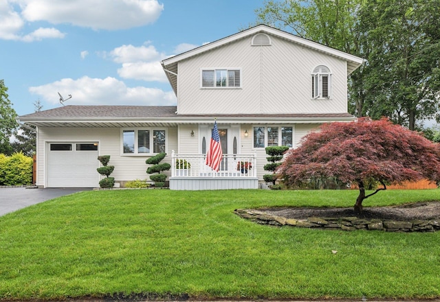 57 Sarah Dr, Lake Grove, NY 11755 - traditional-style house with an attached garage, a porch, asphalt driveway, and a front yard