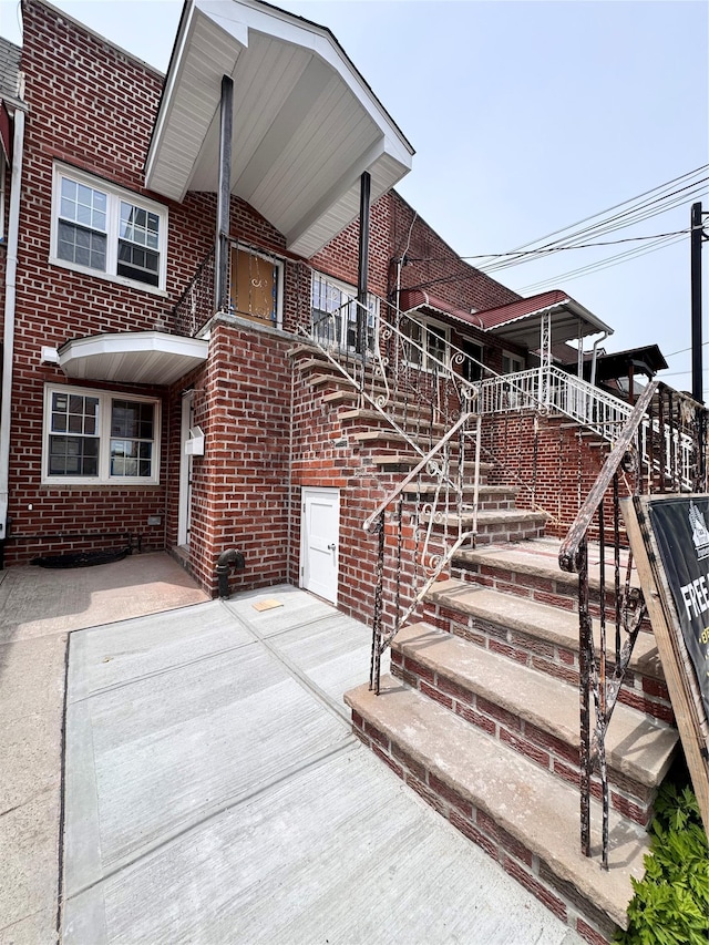 982 E 106th St, Brooklyn, NY 11236 - view of front of house with brick siding and stairs