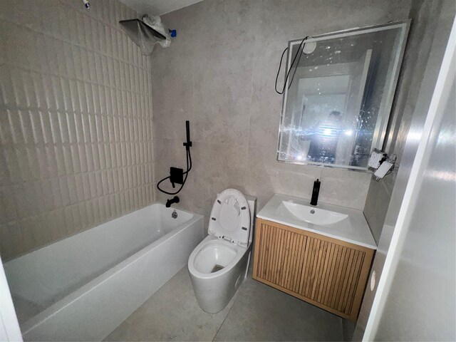 982 E 106th St, Brooklyn, NY 11236 - bathroom with shower / bathtub combination, vanity, tile patterned floors, and tile walls