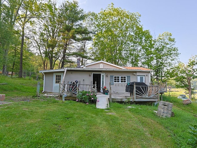 67 Budd Rd, Wurtsboro, NY 12790 - back of property with a deck and a lawn