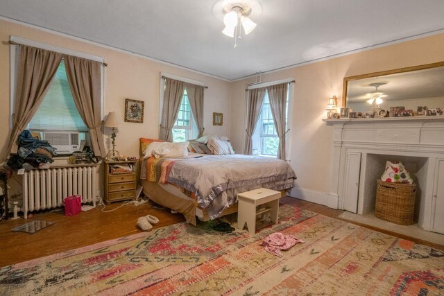 23 Gracemere, Tarrytown, NY 10591 - bedroom with radiator heating unit, cooling unit, light wood-style floors, and crown molding