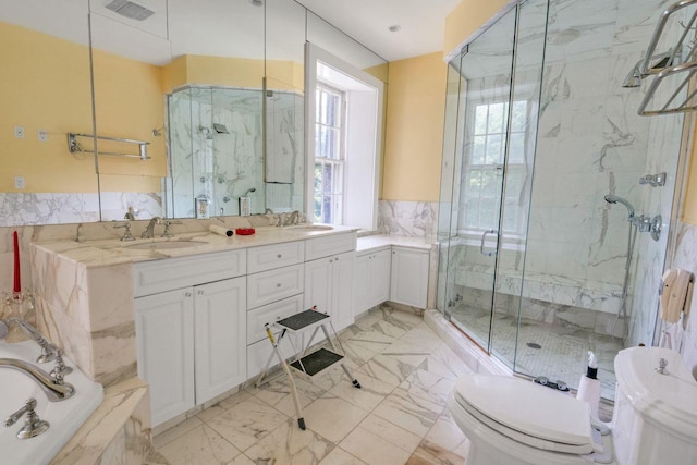 23 Gracemere, Tarrytown, NY 10591 - bathroom featuring healthy amount of natural light, a marble finish shower, double vanity, and a bath