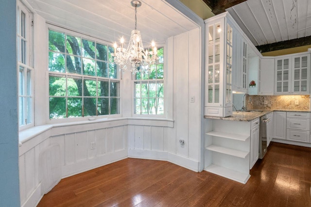 23 Gracemere, Tarrytown, NY 10591 - unfurnished dining area featuring dark wood-style floors, a chandelier, plenty of natural light, and wooden ceiling