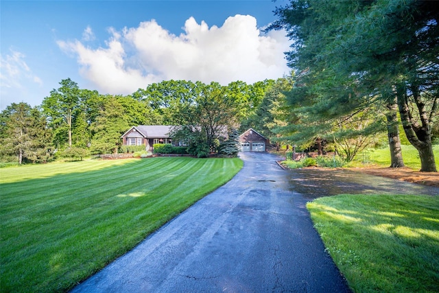 322 Union School Rd, Middletown, NY 10941 - view of front of home with a front yard, asphalt driveway, and a detached garage