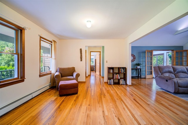 322 Union School Rd, Middletown, NY 10941 - living room featuring baseboard heating, light wood-style flooring, and plenty of natural light
