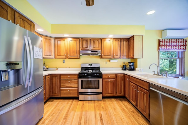 322 Union School Rd, Middletown, NY 10941 - kitchen featuring stainless steel appliances, under cabinet range hood, brown cabinets, light countertops, and recessed lighting