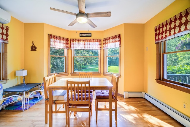322 Union School Rd, Middletown, NY 10941 - dining space with baseboard heating, light wood finished floors, a wall mounted AC, and a ceiling fan