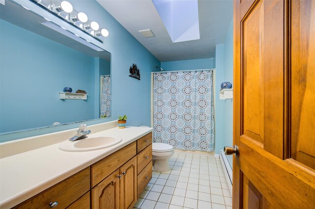 322 Union School Rd, Middletown, NY 10941 - full bath with vanity, tile patterned floors, a baseboard radiator, a shower with curtain, and a skylight