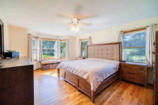 322 Union School Rd, Middletown, NY 10941 - bedroom with light wood finished floors, ceiling fan, and a baseboard heating unit
