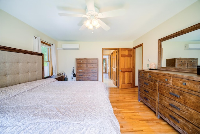322 Union School Rd, Middletown, NY 10941 - bedroom featuring a wall unit AC, a wall mounted air conditioner, light wood-style flooring, and ceiling fan