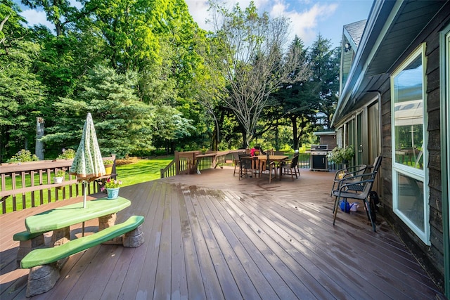 322 Union School Rd, Middletown, NY 10941 - wooden deck featuring outdoor dining space, view of wooded area, and a lawn