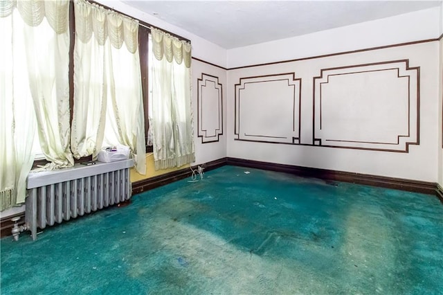 3820 Clarendon Rd, Brooklyn, NY 11203 - carpeted spare room with radiator and baseboards