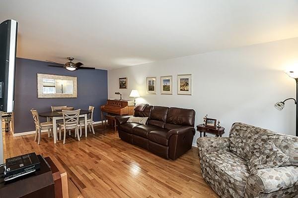 183 Atlantic Ave Unit 8, Lynbrook, NY 11563 - living room with light wood-style floors and ceiling fan