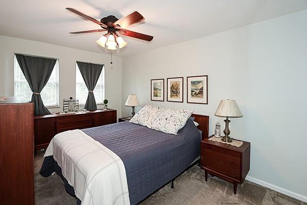 183 Atlantic Ave Unit 8, Lynbrook, NY 11563 - bedroom with carpet flooring and ceiling fan