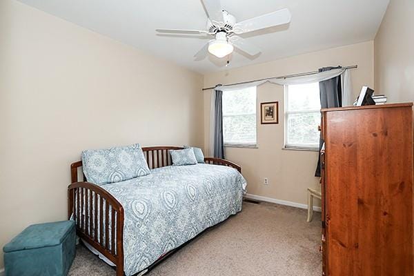 183 Atlantic Ave Unit 8, Lynbrook, NY 11563 - bedroom with light carpet and a ceiling fan