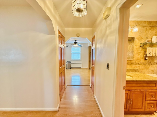 945 Swinton Ave, Bronx, NY 10465 - hallway with radiator and light wood-style floors